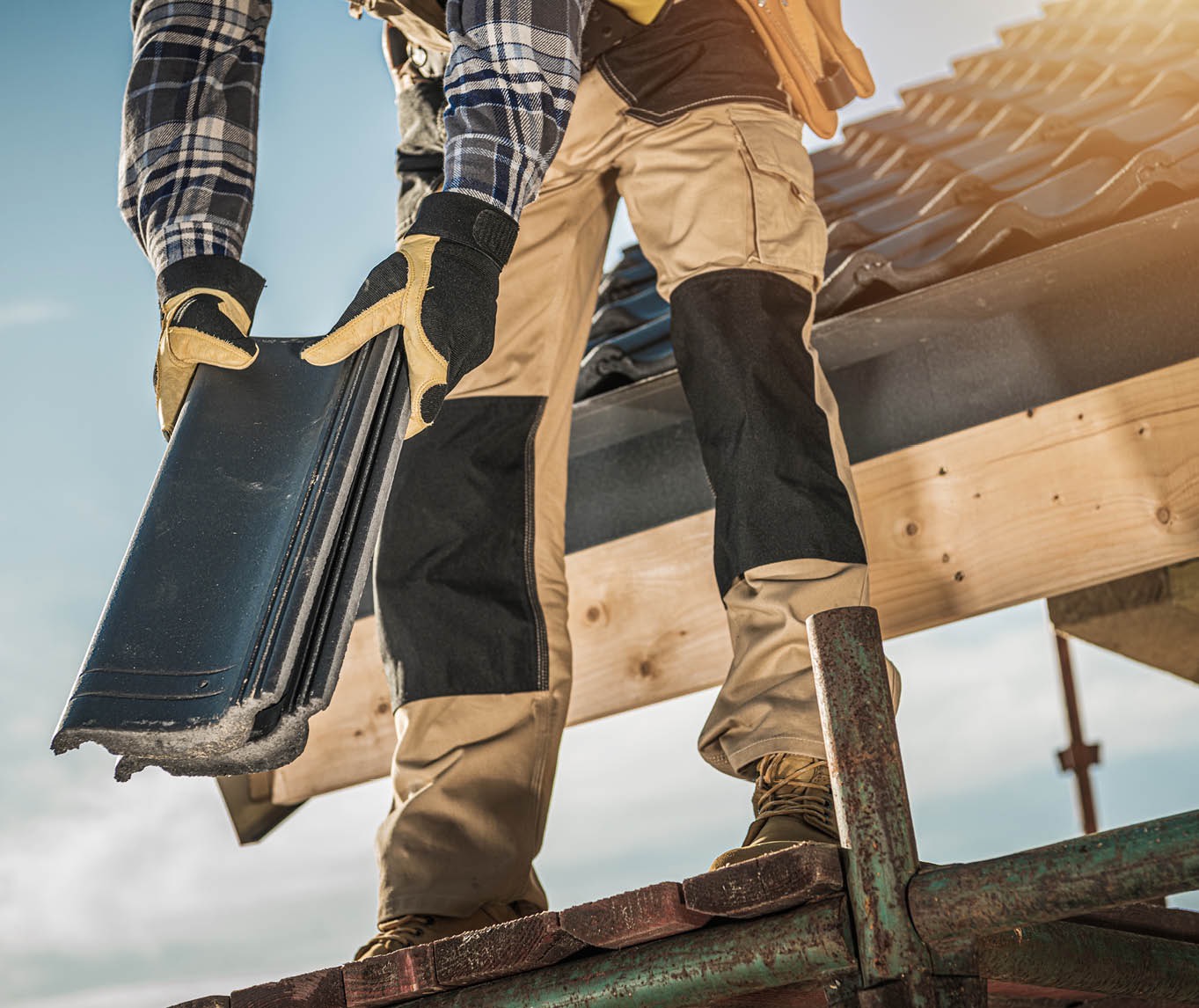 man repairing the roof