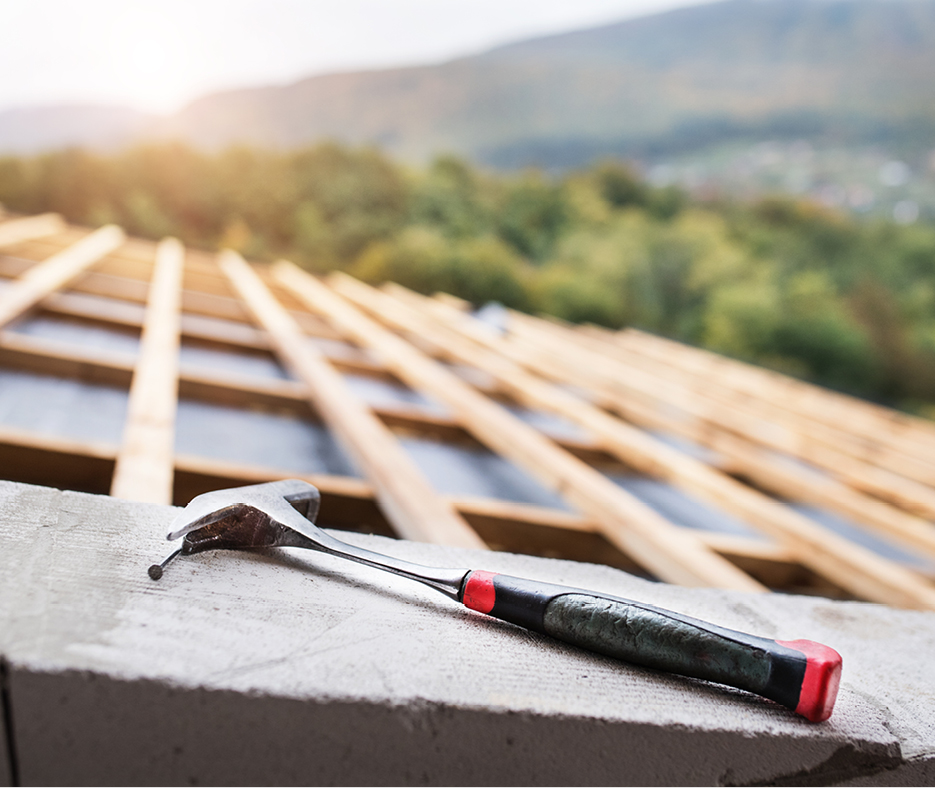 a hammer on the roof under construction