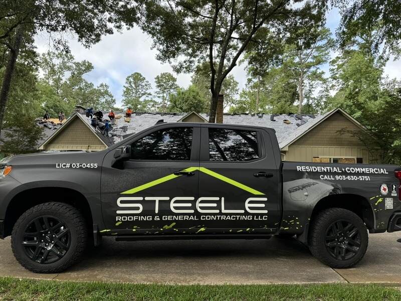 steele roofing truck on a home roofing jobsite