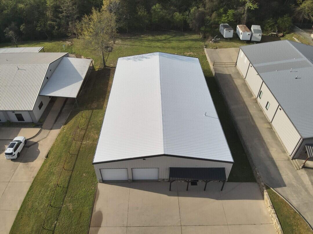 fluid applied roof coating on metal building